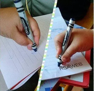children writing with crayons 