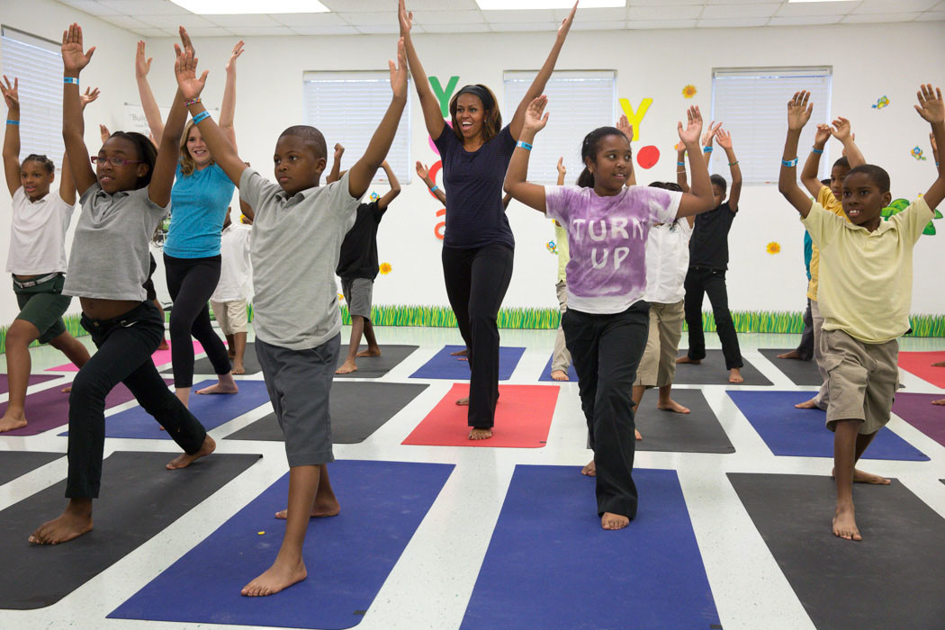 First Lady Michelle Obama participates in yoga with Jenna Bush and kids