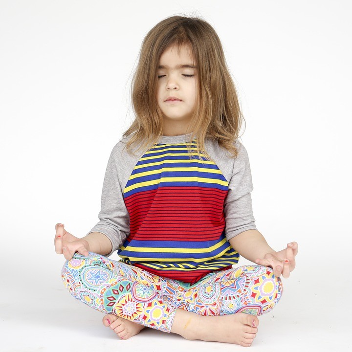 a young girl doing yoga