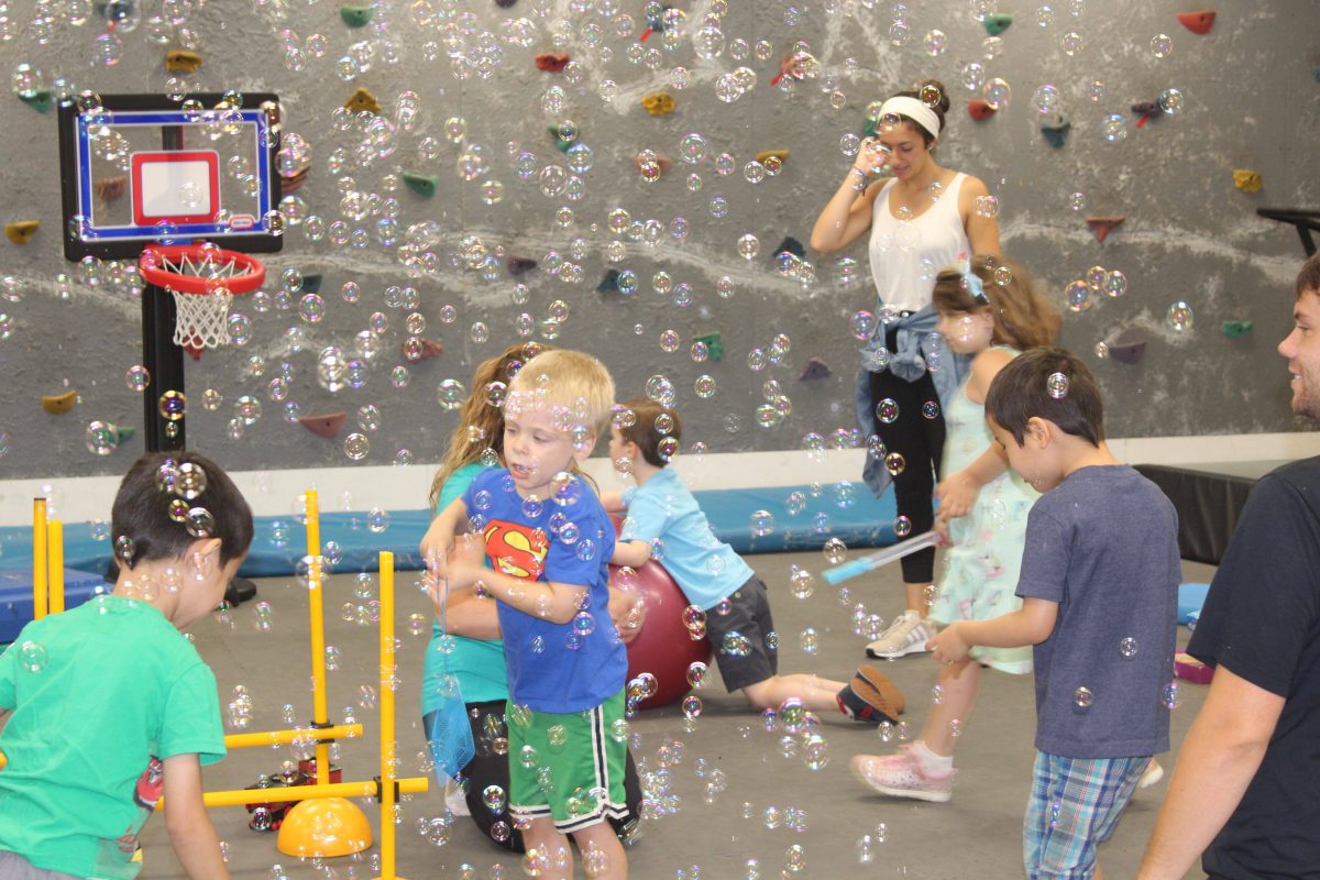 kids playing with bubbles