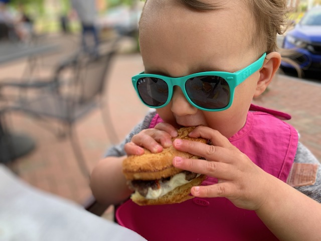 Child biting into a multi-textured food