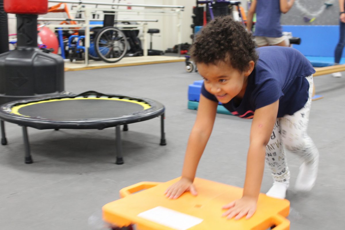 child animal crawling to benefit her core strength, while having fun