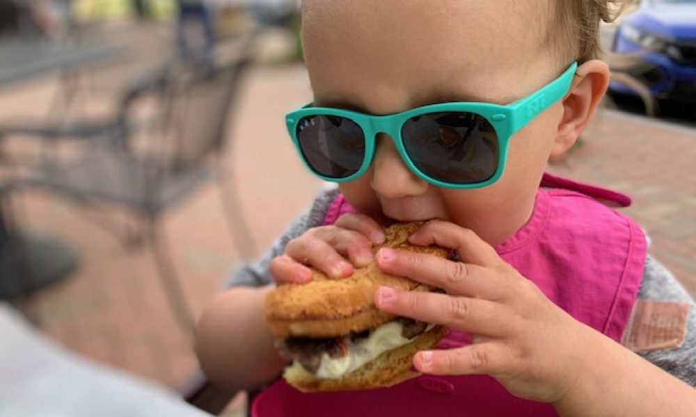 Child biting into a multi-textured food