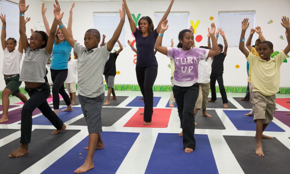 First Lady Michelle Obama participates in yoga with Jenna Bush and kids